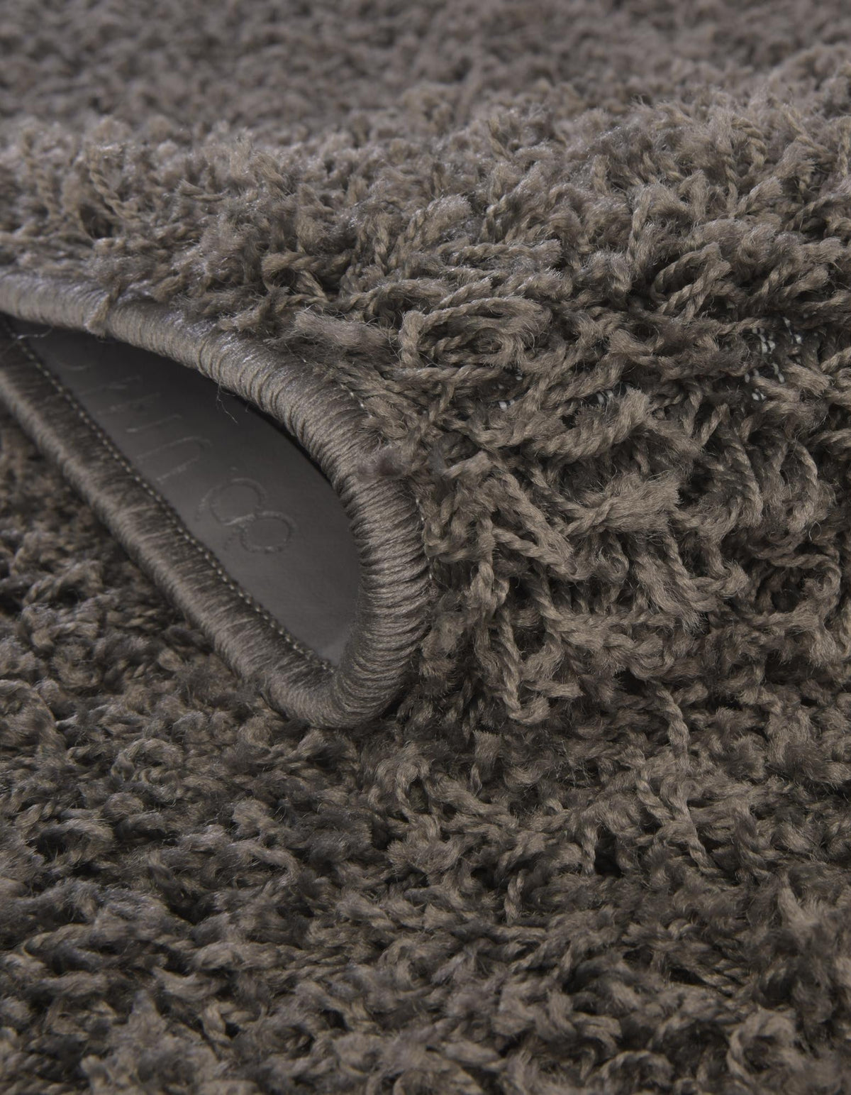 Quadratisch Hochflorteppich Solid Shag in Graphitgrau von Hadorn™ - Lifestyle Image