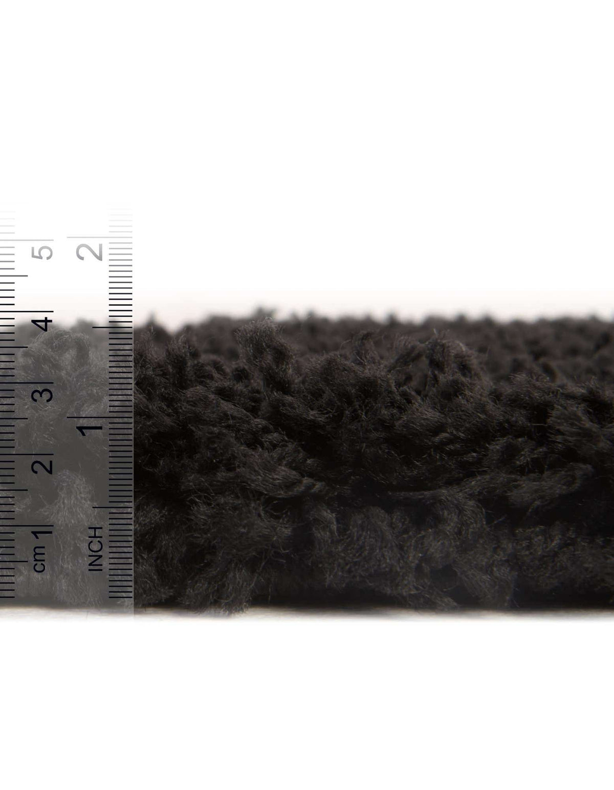 Quadratisch Hochflorteppich Solid Shag in Tiefschwarz von Hadorn™ - Lifestyle Image