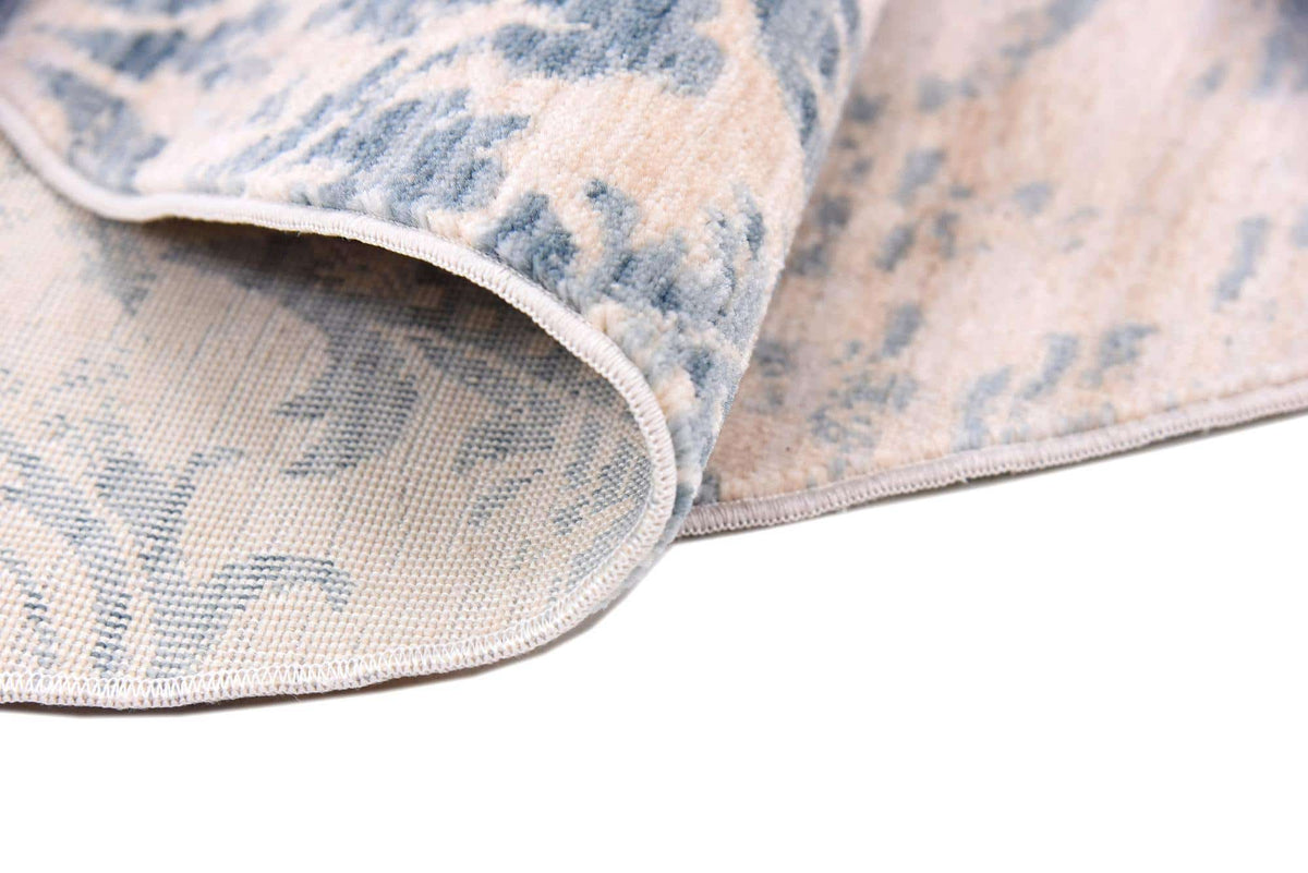 Rund Teppich Restoration in Blau von Hadorn™ - Lifestyle Image