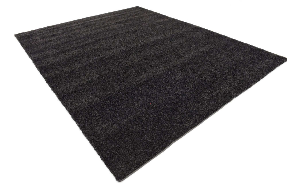 Rechteck Teppich Solid Frieze in Dunkelgrau von Hadorn™ - Lifestyle Image