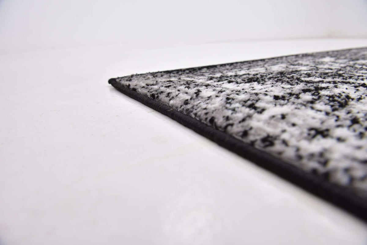 Quadratisch Teppich Monaco in Schwarz von Hadorn™ - Lifestyle Image